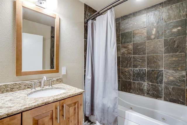 bathroom with shower / bath combo with shower curtain and vanity