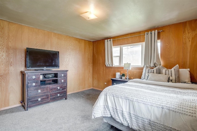 carpeted bedroom with wooden walls