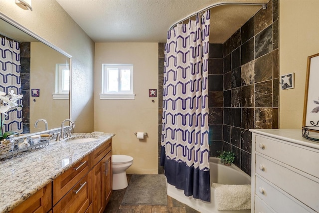 full bathroom with a textured ceiling, toilet, vanity, and shower / bathtub combination with curtain