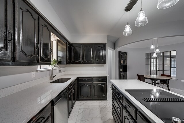 305 Santa Fe Trl, Waxahachie, TX 75165 - kitchen with dishwashing machine, black electric cooktop, dark cabinetry, hanging light fixtures, and light marble finish floors