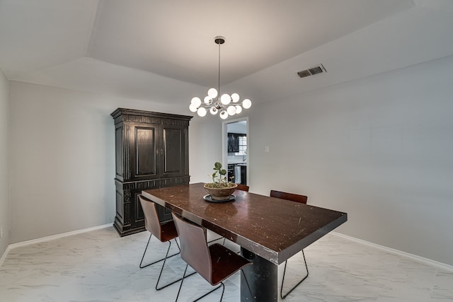 dining room with vaulted ceiling and an inviting chandelier