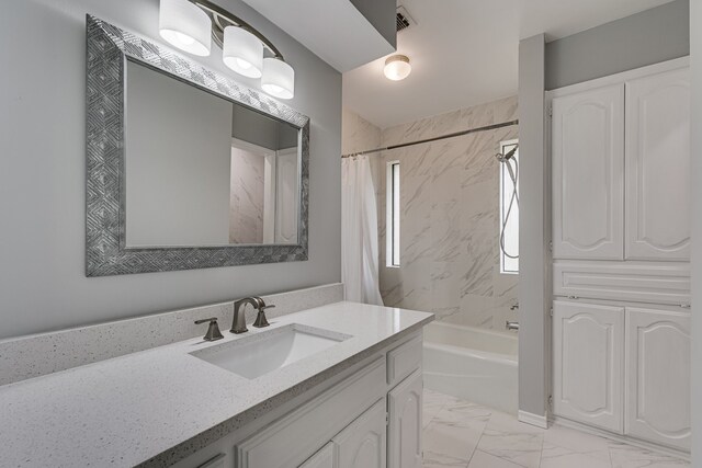 305 Santa Fe Trl, Waxahachie, TX 75165 - bathroom featuring vanity, shower / tub combo with curtain, and marble look tiles