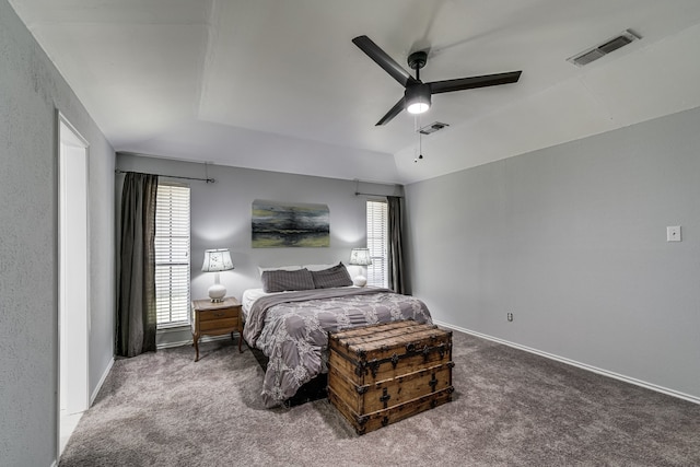 carpeted bedroom featuring ceiling fan and vaulted ceiling