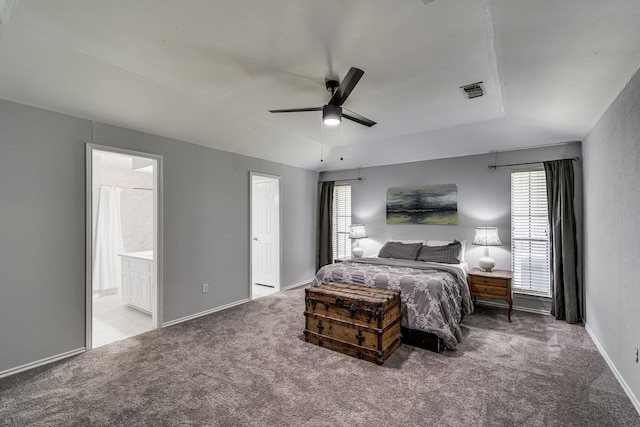 bedroom with connected bathroom, ceiling fan, and carpet floors