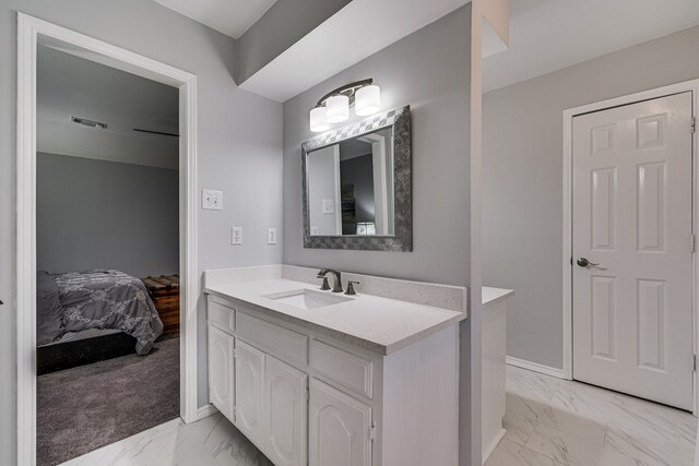 305 Santa Fe Trl, Waxahachie, TX 75165 - bathroom featuring marble look tiles, vanity, and ensuite bathroom
