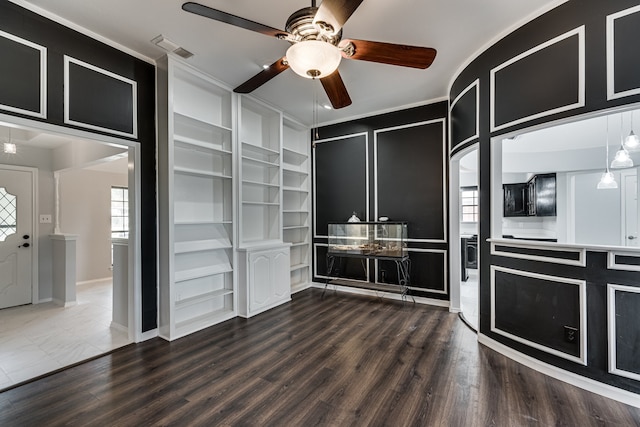 kitchen featuring built in shelves, wood-type flooring, ornamental molding, and ceiling fan