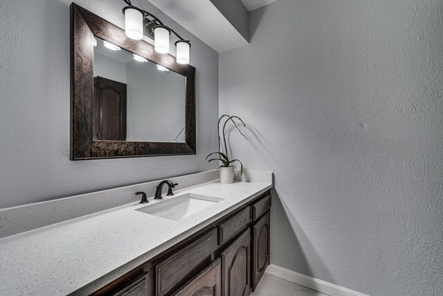 305 Santa Fe Trl, Waxahachie, TX 75165 - bathroom with vanity and a textured wall