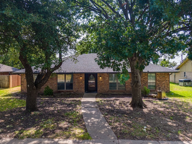 single story home featuring central AC unit