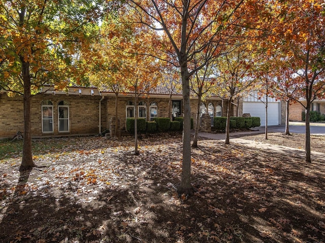 ranch-style house featuring a garage