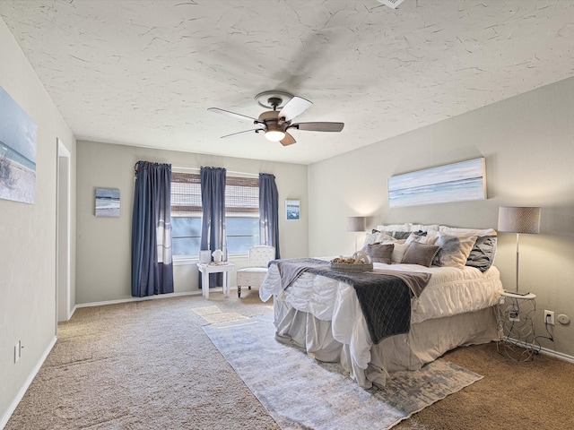 carpeted bedroom with a textured ceiling and ceiling fan