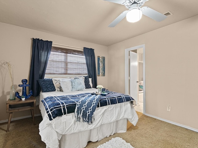 bedroom featuring ceiling fan, connected bathroom, and carpet floors