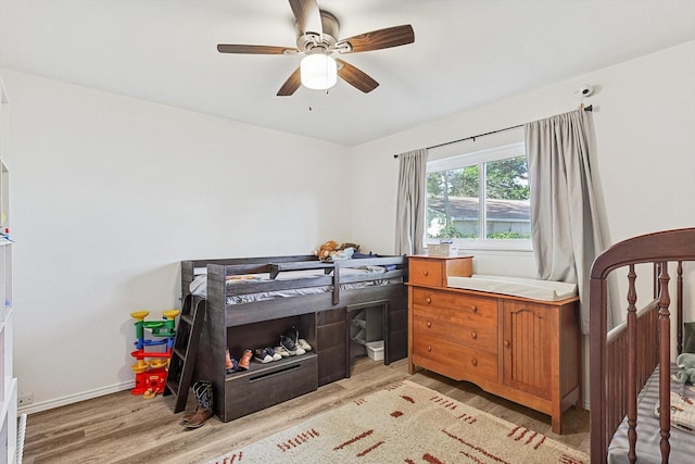 bedroom featuring ceiling fan and light wood-type flooring