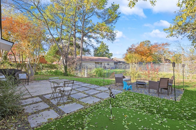 view of patio featuring an outdoor fire pit