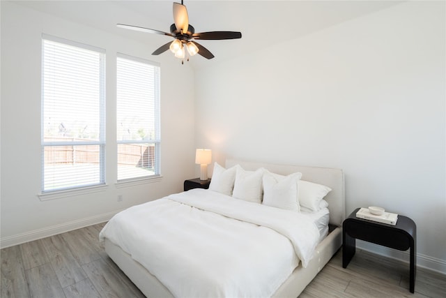 bedroom featuring ceiling fan and light hardwood / wood-style floors