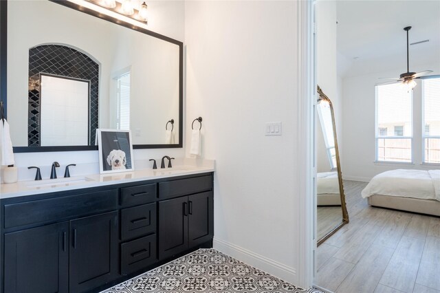 bathroom featuring hardwood / wood-style floors, ceiling fan, and vanity