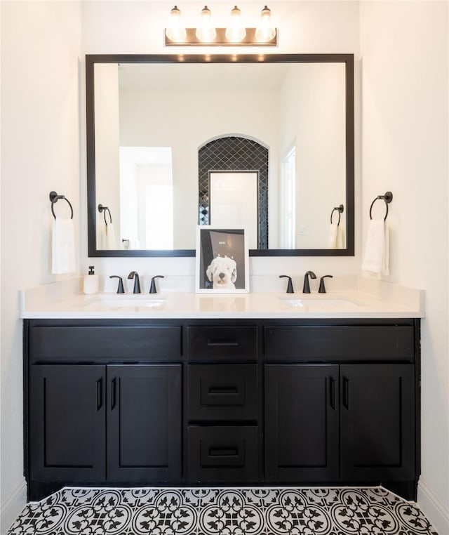 bathroom with tile patterned flooring and vanity