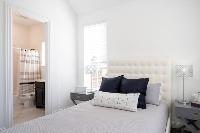 bedroom featuring connected bathroom