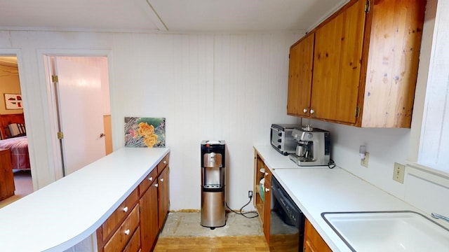 kitchen with black dishwasher and sink