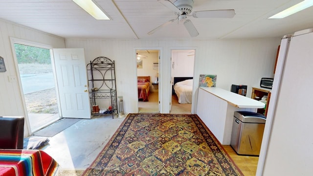 interior space featuring ceiling fan