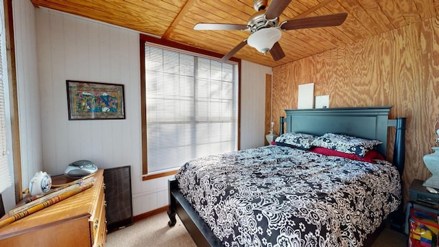 carpeted bedroom with wooden ceiling and ceiling fan