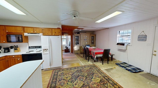 kitchen featuring cooling unit, white appliances, and ceiling fan