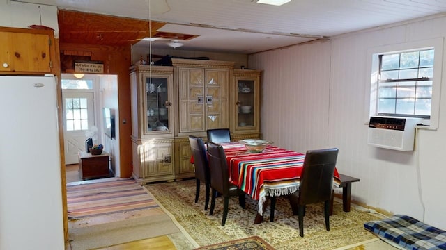 dining space with light wood-type flooring