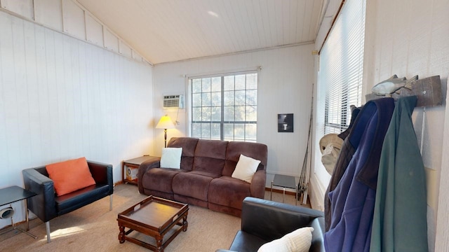 living room featuring vaulted ceiling, light carpet, a wealth of natural light, and a wall mounted AC