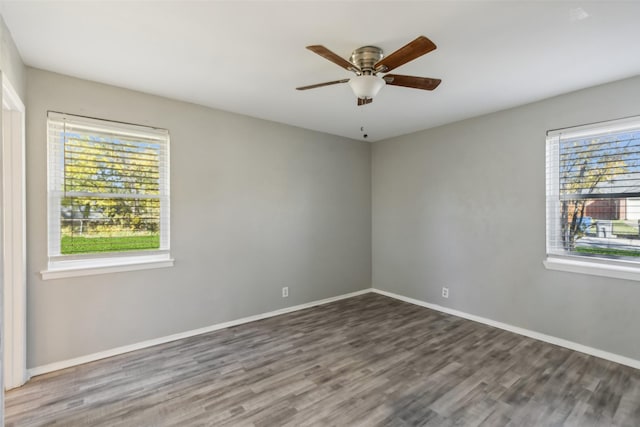 unfurnished room with hardwood / wood-style floors and ceiling fan