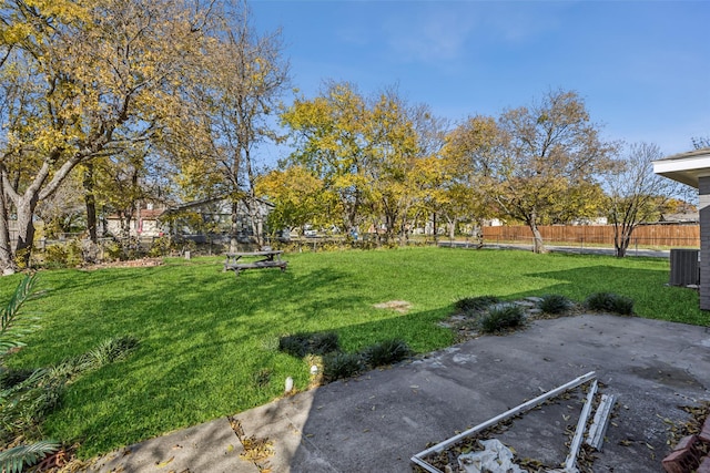 view of yard featuring central AC unit and a patio area