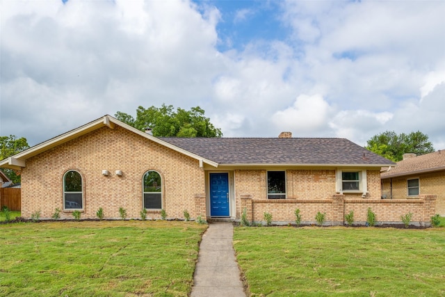 ranch-style house featuring a front yard