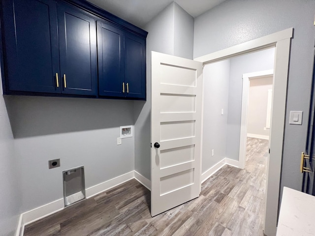 washroom with electric dryer hookup, dark hardwood / wood-style flooring, cabinets, and washer hookup