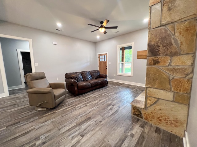 living room featuring hardwood / wood-style flooring and ceiling fan