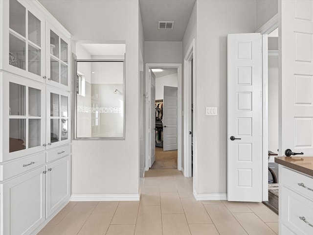 interior space with light tile patterned floors