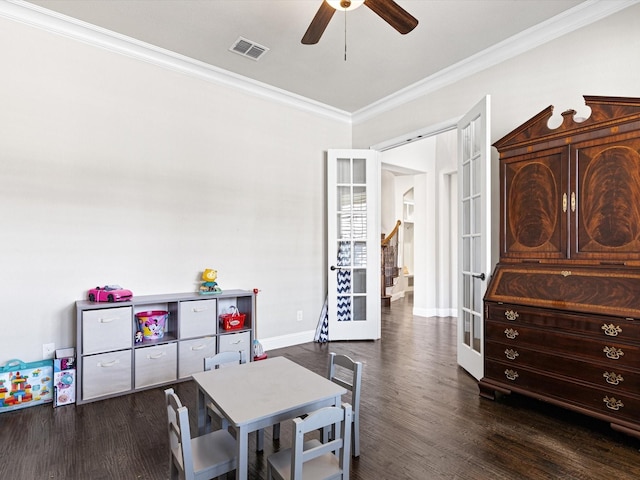 game room featuring french doors, dark hardwood / wood-style floors, and ornamental molding