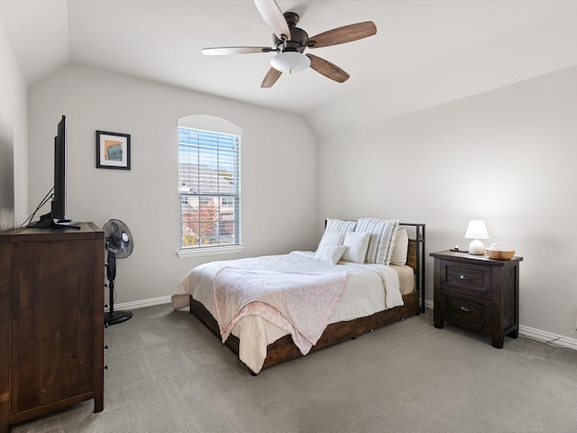 carpeted bedroom featuring ceiling fan and vaulted ceiling