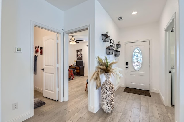 entrance foyer featuring ceiling fan and light wood-type flooring