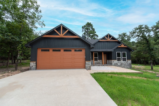 view of front of home featuring a garage and a front lawn