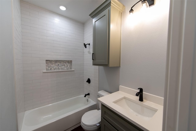 full bathroom with vanity, toilet, and tiled shower / bath combo