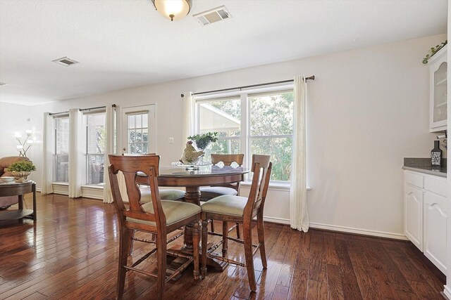 dining area featuring dark hardwood / wood-style flooring