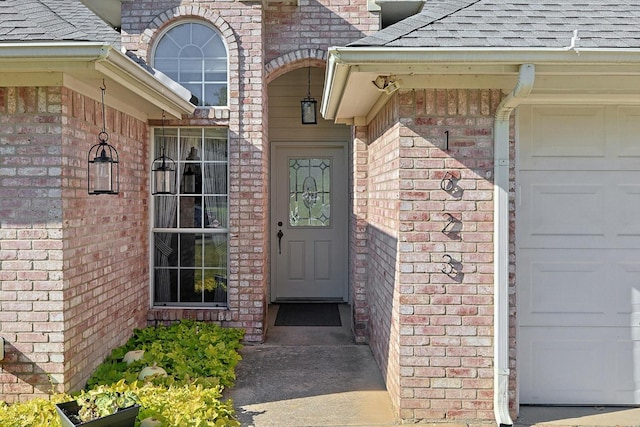 doorway to property featuring a garage