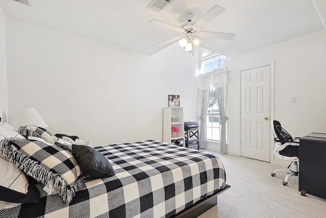 carpeted bedroom with ceiling fan and multiple windows