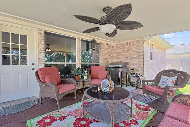 view of patio featuring area for grilling and ceiling fan