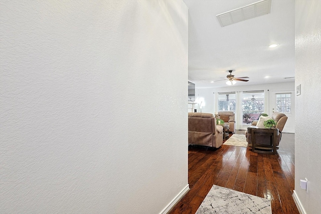 hall with dark hardwood / wood-style flooring