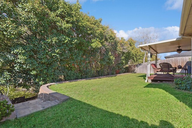 view of yard with a wooden deck