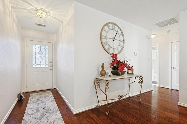 entryway featuring dark wood-type flooring