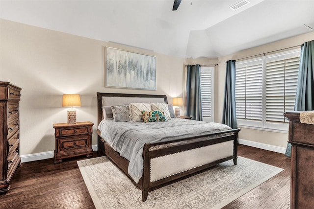 bedroom with dark wood-type flooring, ceiling fan, and lofted ceiling