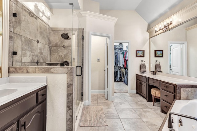 bathroom featuring tile patterned flooring, vanity, lofted ceiling, and plus walk in shower