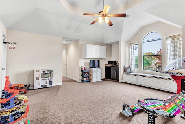 playroom featuring ceiling fan, lofted ceiling, and light carpet