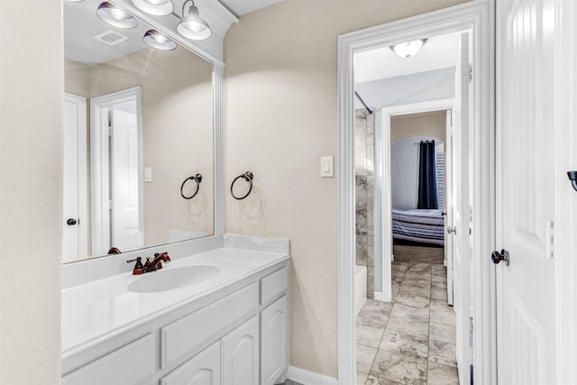 bathroom featuring vanity and  shower combination