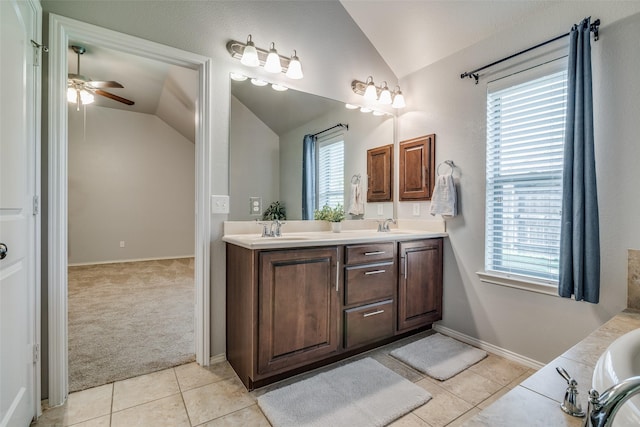 bathroom featuring tile patterned floors, plenty of natural light, and vaulted ceiling